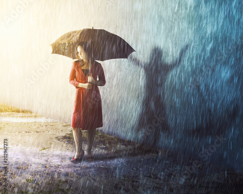 Woman in rain storm with shadow