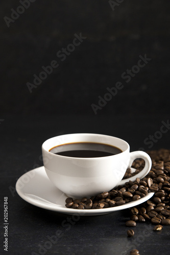 Cup of Strong Black Coffee in a White Cup and Saucer