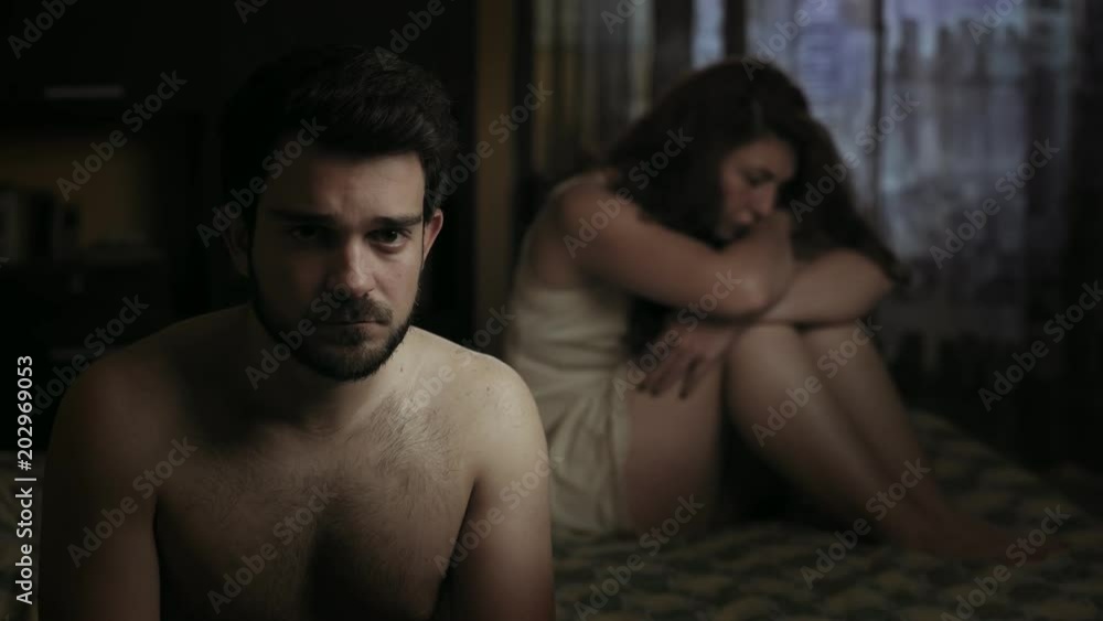 male sexual impotence: young sad couple in bed male sexual impotence: young sad couple in bed