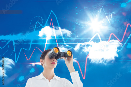 Photography Business woman  looking through binoculars against bright blue sky with clouds
