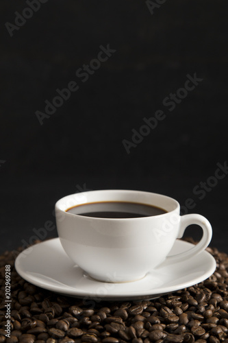 Cup of Strong Black Coffee in a White Cup and Saucer