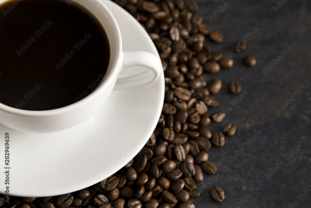 Fototapeta premium Cup of Strong Black Coffee in a White Cup and Saucer