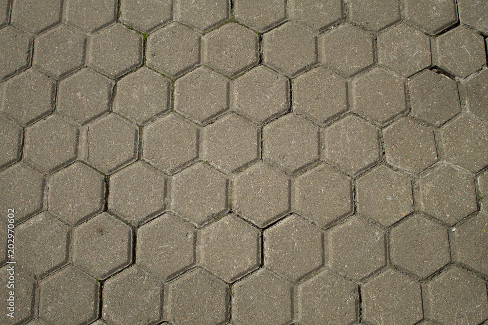 The texture of the paving slab. Hexagonal form