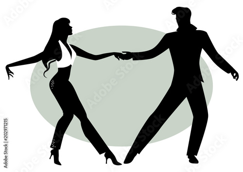 Silhouettes of young couple dancing