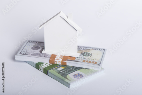 House Made of Cash Money Isolated on White Background. photo