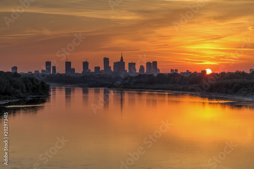 Evening panorama of Warsaw skyline over Vistula river at sunset, Poland © lukszczepanski