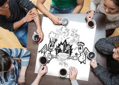 People sitting around table drinking coffee with page showing angel and devil doodle