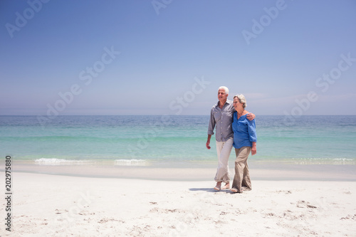 Senior couple walking on the beach
