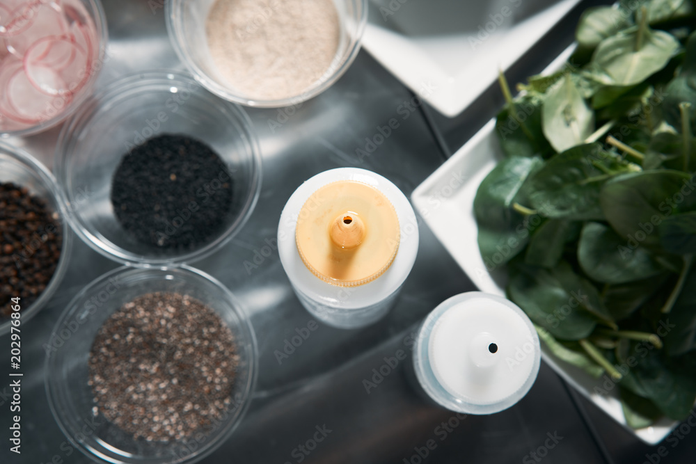 Closeup of spices for cooking. Cooking salad in a professional kitchen. Closeup of spices for cooking. Cooking salad in a professional kitchen.