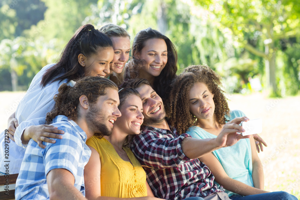 Smiling friends taking a selfie Smiling friends taking a selfie