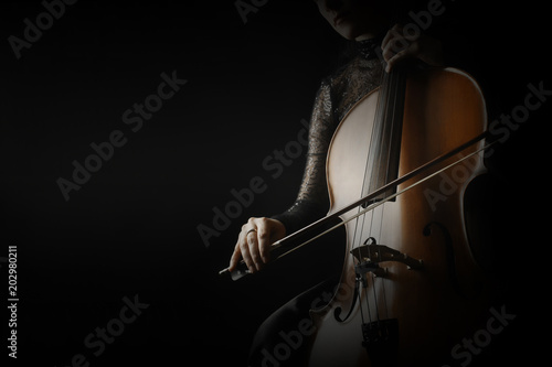 Cello player. Cellist hands playing cello closeup