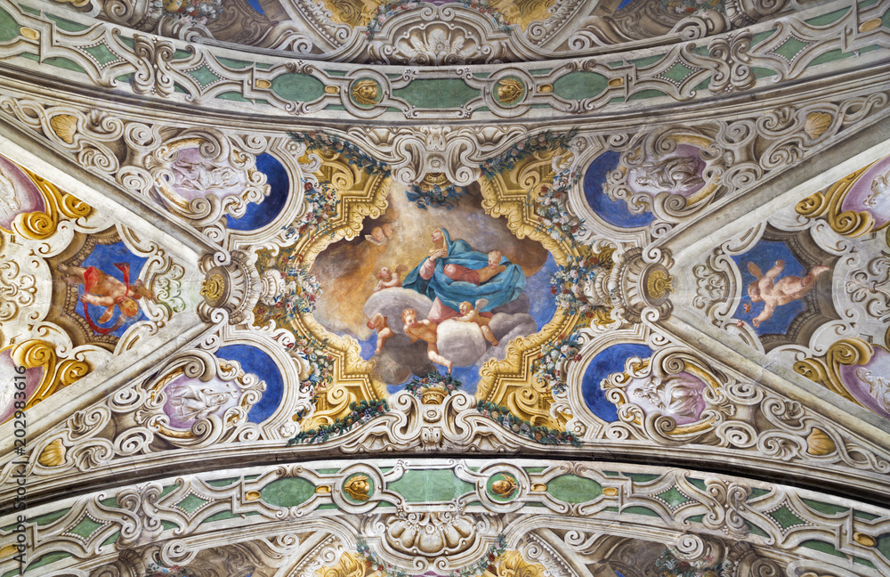 PARMA, ITALY - APRIL 16, 2018: The ceiling freso of The Asumption of Virgin Mary in church Chiesa di Santa Croce by Giovanni Maria Conti della Camera (1614 - 1670).