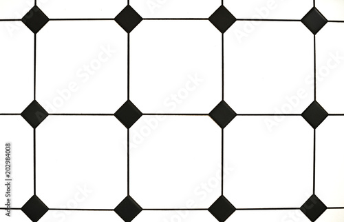 Elements of interior. Stylish black and white tiles. Close-up  