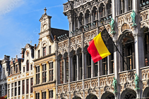 Belgian flag on the Grand Place Broodhuis in Brussels.