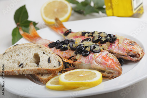 Baked goatfishes with olives