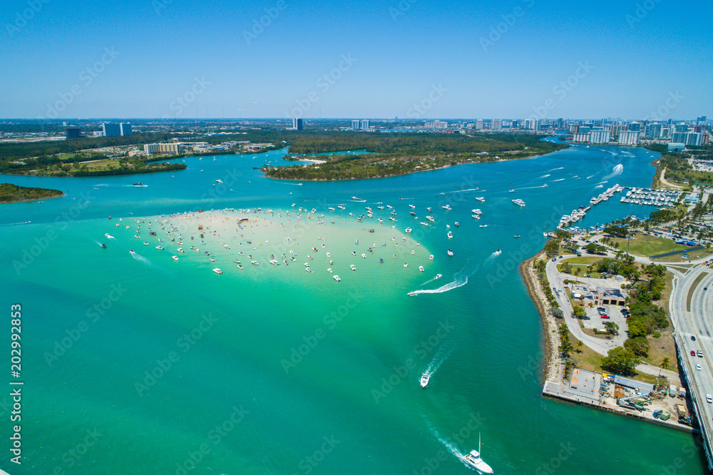 Aerial drone image of Haulover Beach Miami Florida sandbar with boats crowded on the weekend