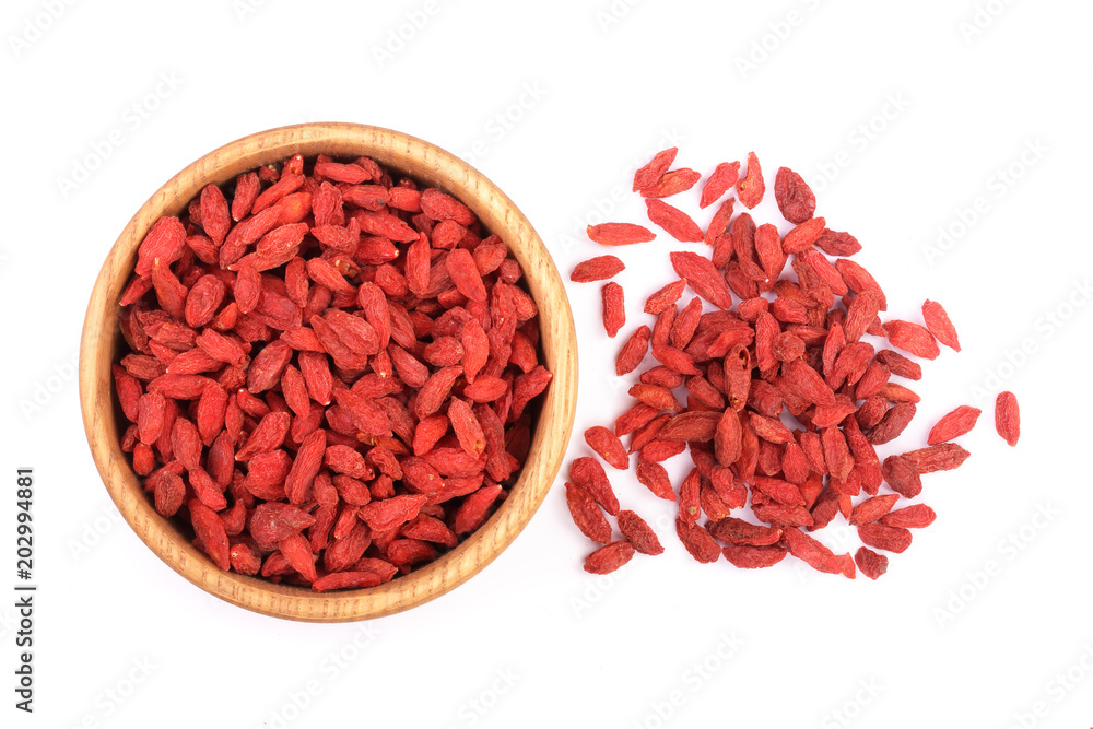 Dried goji berries in wooden bowl Isolated on white background Dried goji berries in wooden bowl Isolated on white background