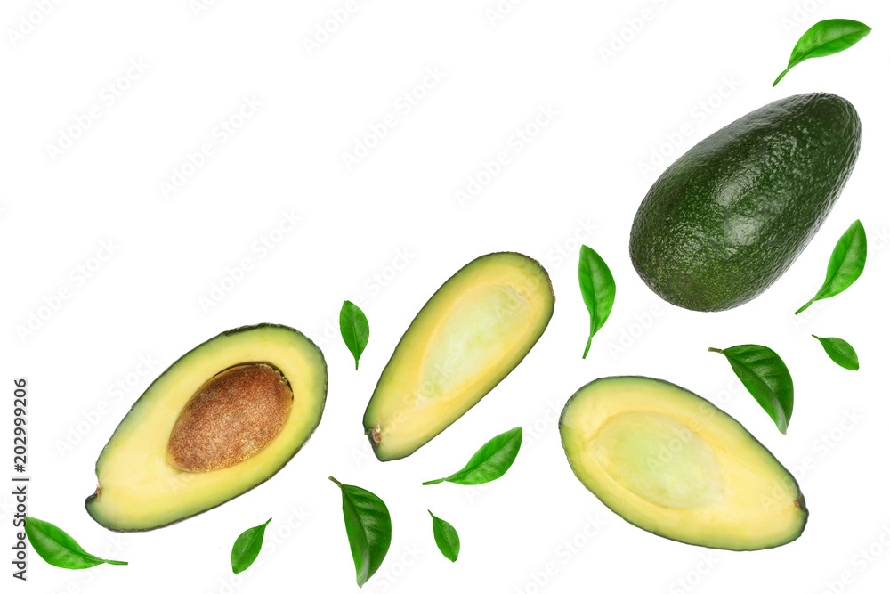 whole and half avocado decorated with green leaves isolated on white background close-up. Top view whole and half avocado decorated with green leaves isolated on white background close-up. Top view