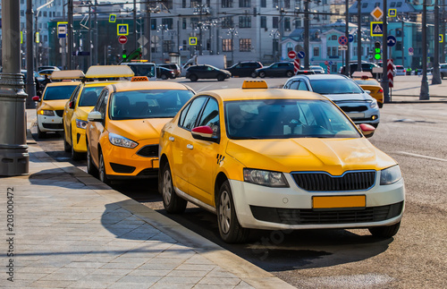 lots of yellow taxis in the Parking lot
