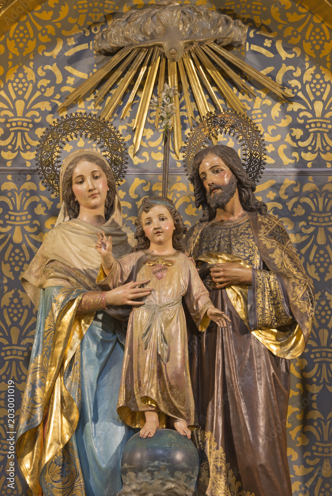 ZARAGOZA, SPAIN - MARCH 3, 2018: The carved polychrome sculpture of Holy Family in church Iglesia de San Miguel de los Navarros form 19, cent.