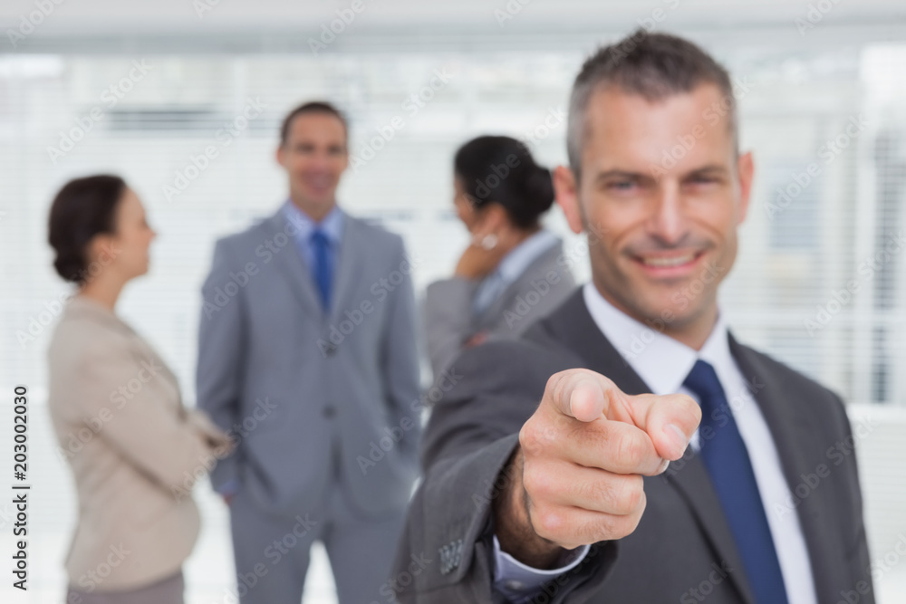 Cheerful businessman pointing Cheerful businessman pointing