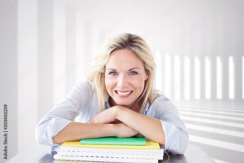 Mature student smiling against curved white room Mature student smiling against curved white room