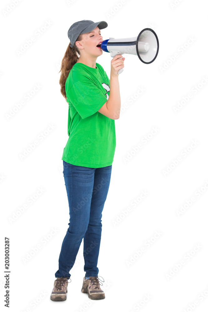 Motivated pretty environmental activist shouting in a megaphone Motivated pretty environmental activist shouting in a megaphone