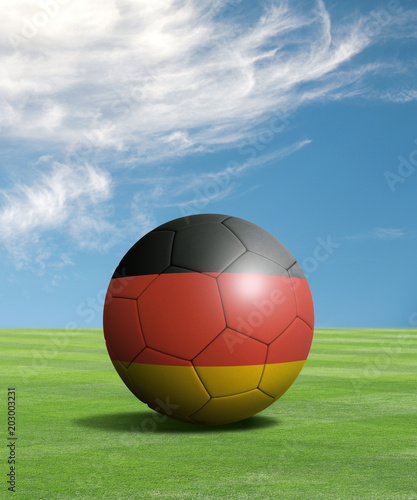 Soccer ball with Germany flags in a green field  