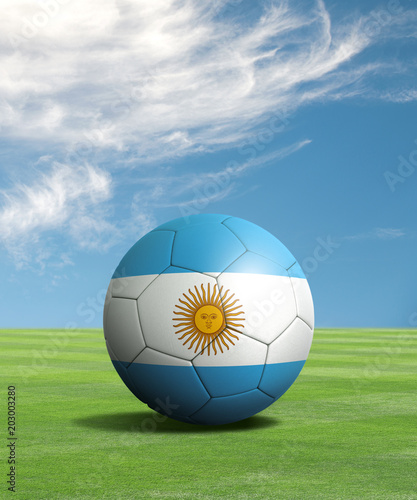 Soccer ball with Argentina flags in a green field  