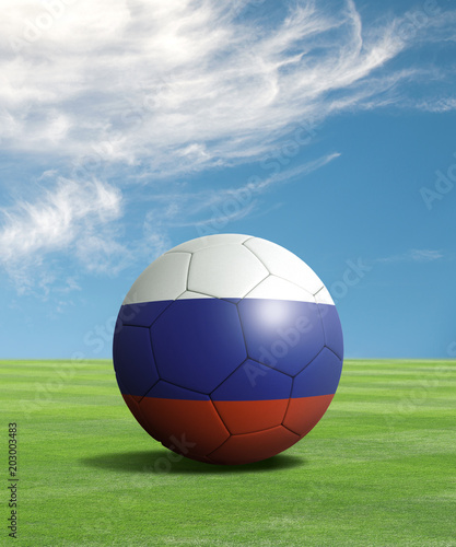 Soccer ball with Russia flags in a green field  