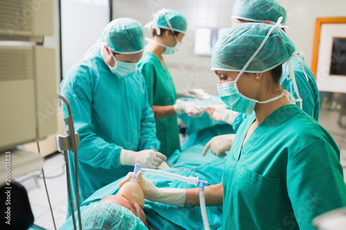 View of a nurse holding an oxygen mask