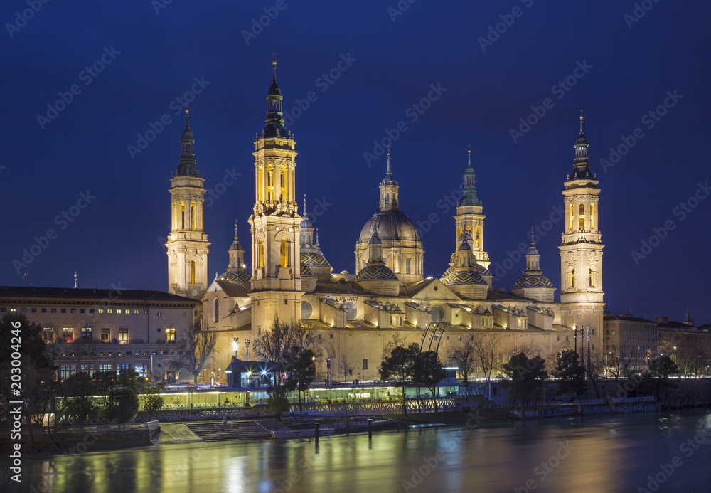 Zaragoza - The Basilica del Pilar with the Ebro river at dusk.