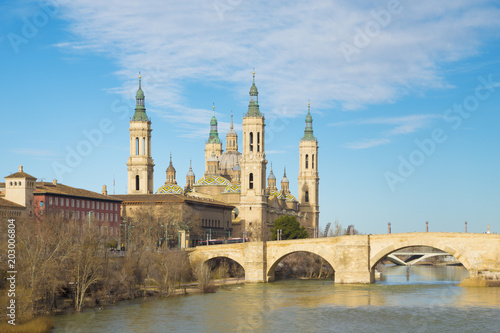 Zaragoza - The bridge Puente de Piedra and Basilica del Pilar with the riverside of Ebro river in the morning light.
