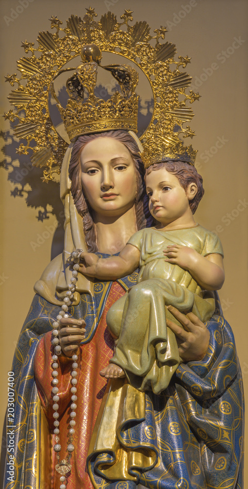 ZARAGOZA, SPAIN - MARCH 2, 2018: The polychome carved statue Madonna in church  Iglesia de la Exaltación de la Santa Cruz.