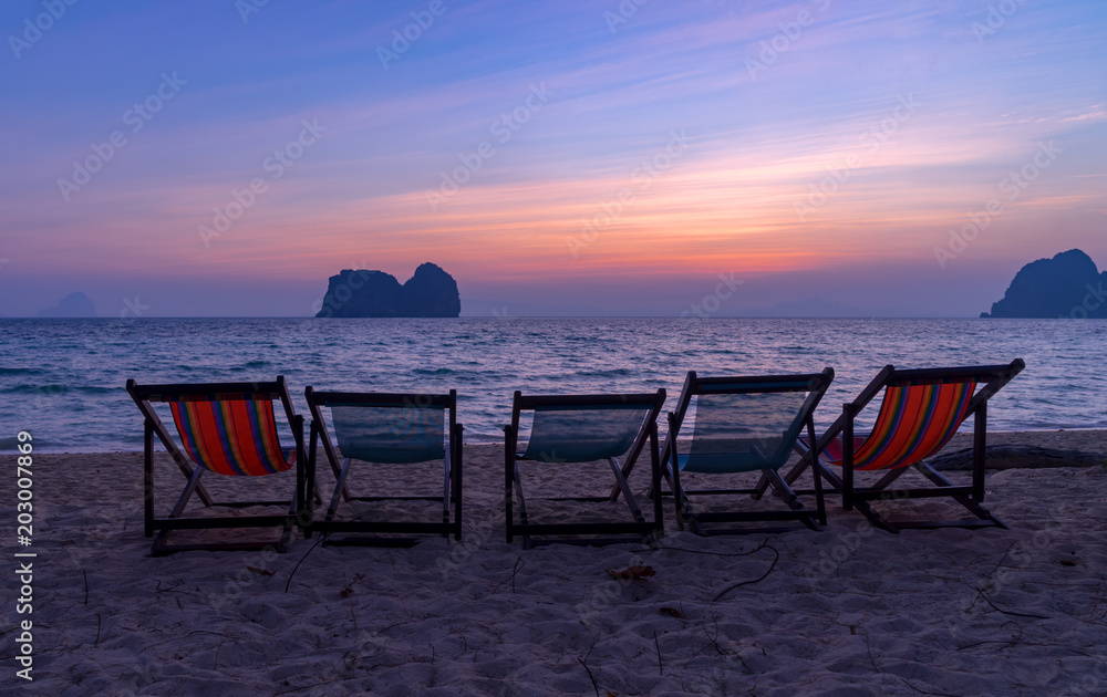 twilight time with beach chair for relax in sunset sky
