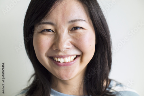 Asian woman smiling to the camera