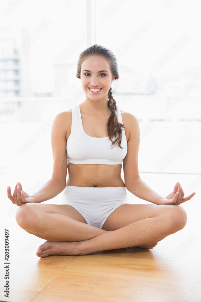 Cheerful relaxed brunette meditating Cheerful relaxed brunette meditating