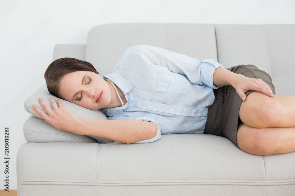 Beautiful well dressed woman sleeping on sofa Beautiful well dressed woman sleeping on sofa