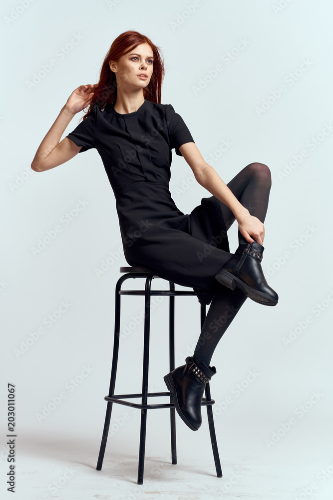 young woman sitting on a chair young woman sitting on a chair