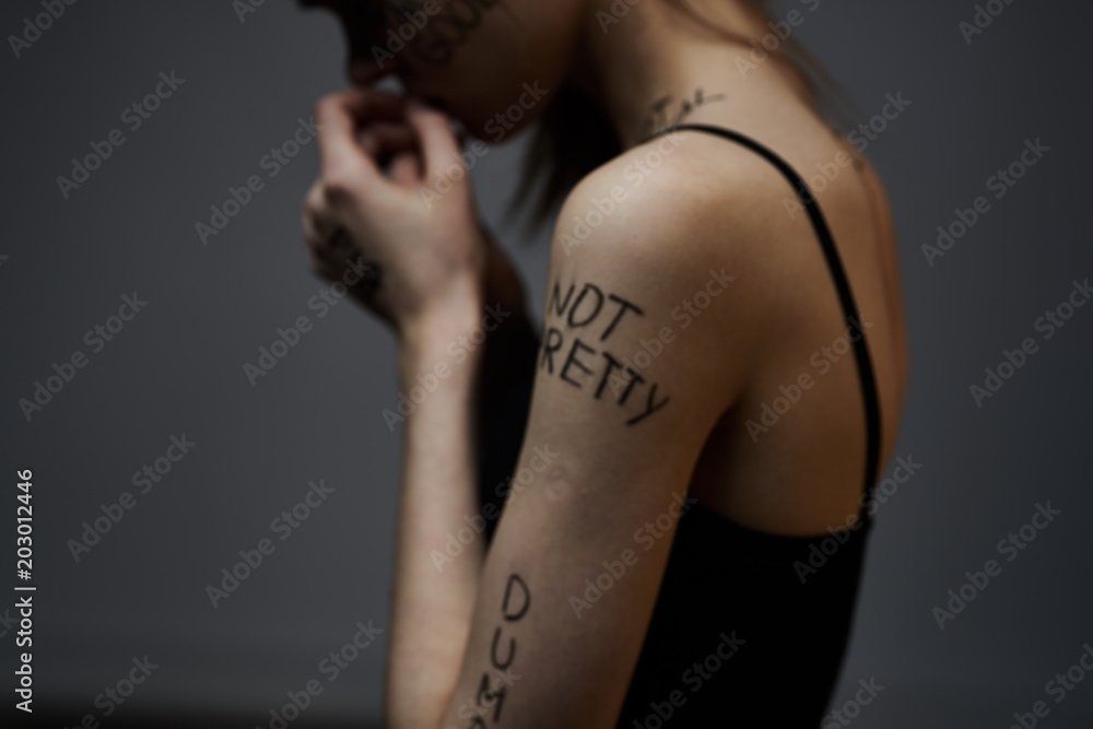 woman with tattoo on isolated background