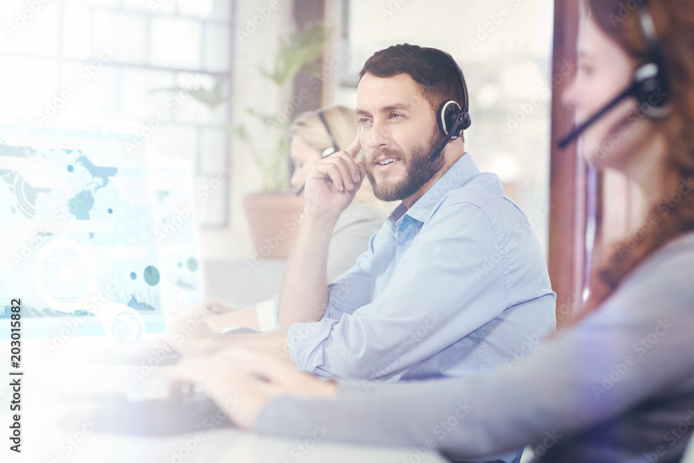 Business interface against thoughtful man working while sitting in office Business interface against thoughtful man working while sitting in office