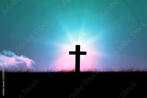Wooden cross against magical sky
