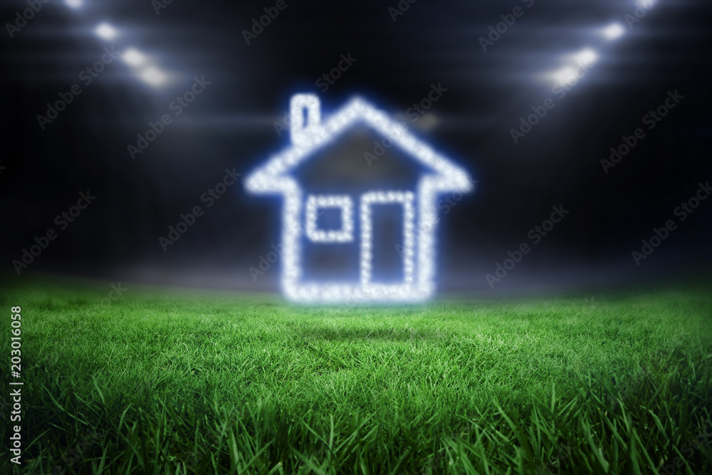 Cloud in shape of house against football pitch with bright lights Cloud in shape of house against football pitch with bright lights