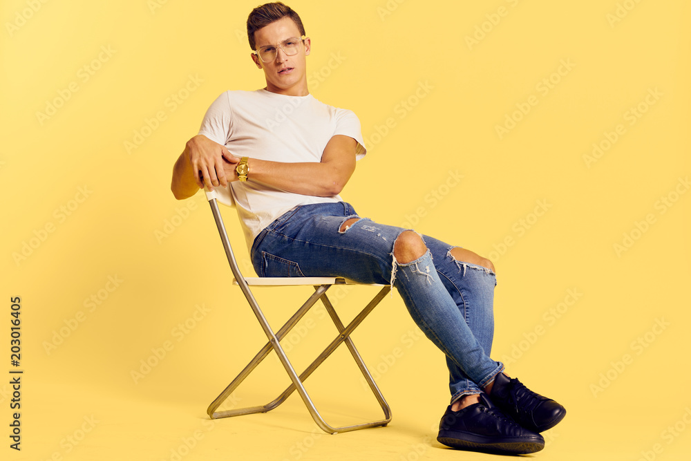 young man sitting on chair