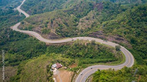 Asphalt road on the hill in Phetchabun province, Thailand. Aerial view from flying drone.