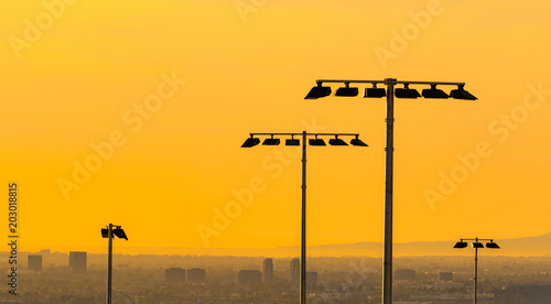 Field lights in Suburban Orange County landscape at sunset in Southern California photo