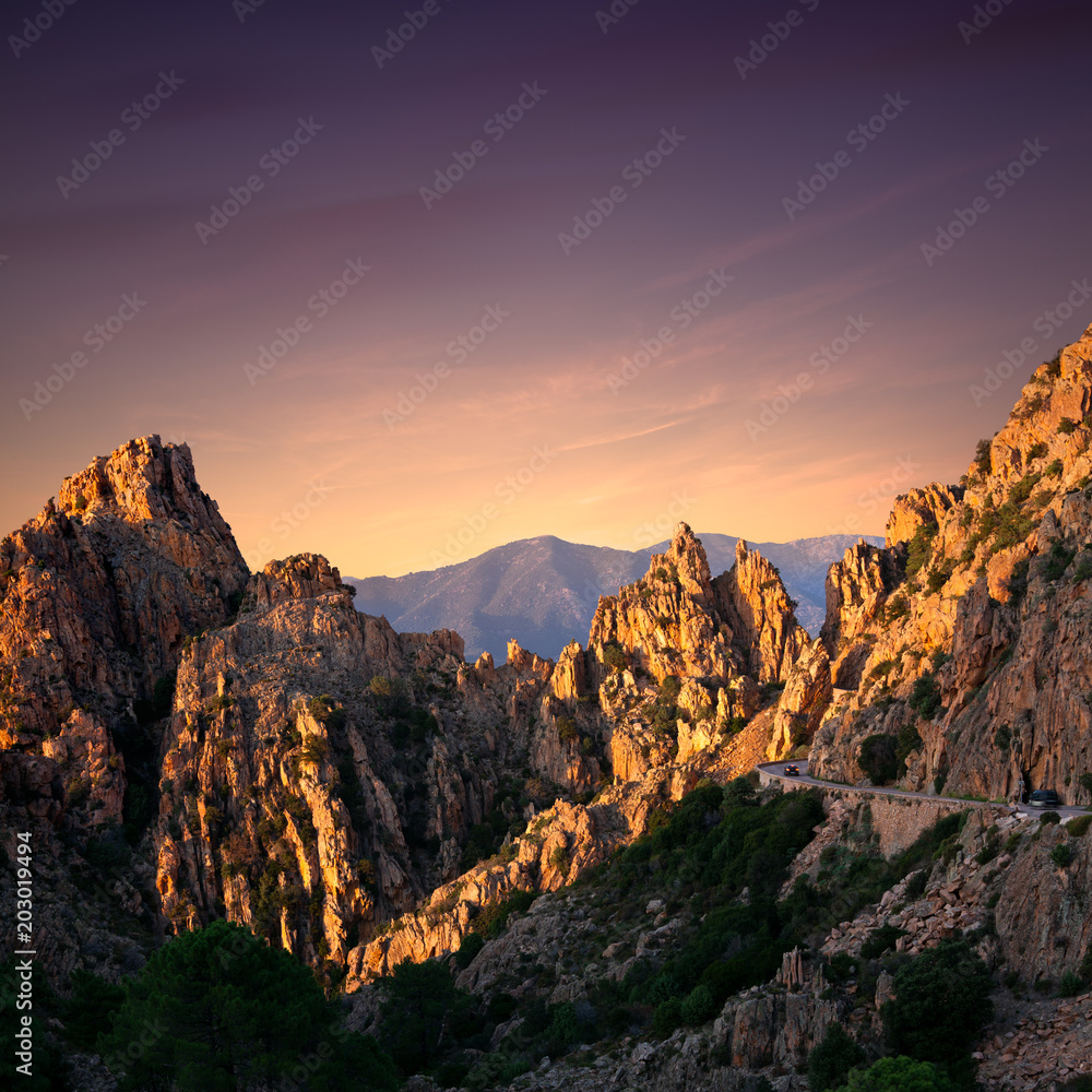 Sunset at the road along the famous Calanques de Piana in Corsica, France