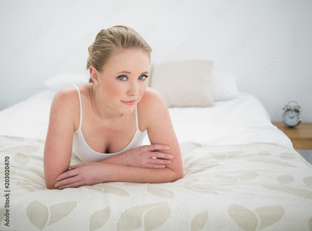 Natural content blonde lying on bed