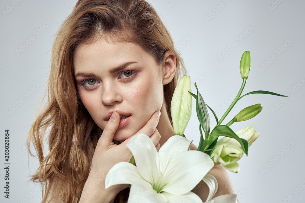 portrait of young woman with flower