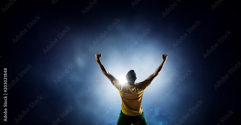 Soccer player at stadium. Mixed media Soccer player at stadium. Mixed media